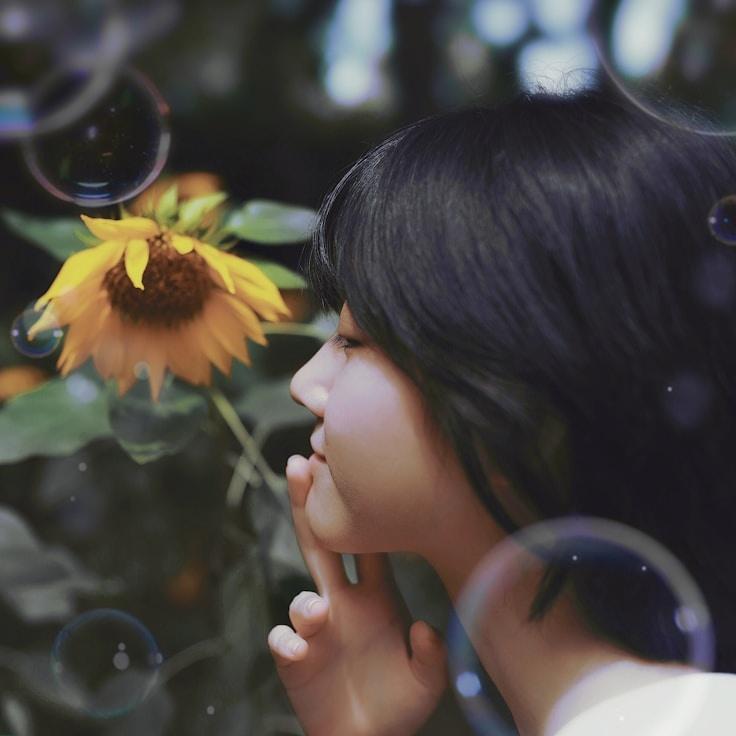 Avery Collins, Lead Design Curator at Solen Vari Matrix, reviewing corporate floral arrangements